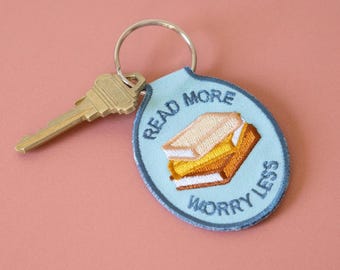 Read More Worry Less Embroidered Keychain | Car key accessory embroidery gift ideas, bookish, book lovers, blue, reader
