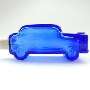 Vintage blauwe kobaltglazen fles herenparfum 1979 Sport Auto Rally