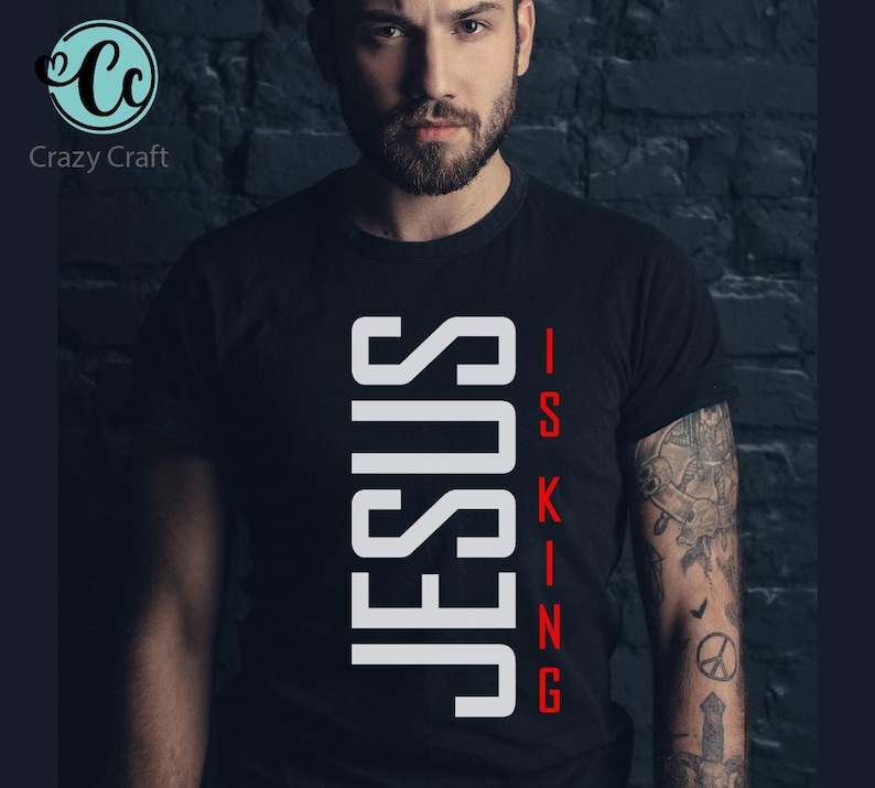 May include: A black t-shirt with white text that reads "JESUS IS KING" in a vertical, blocky font.