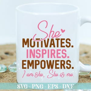 May include: White ceramic mug with a pink and brown design. The mug has the text "She Motivates. Inspires. Empowers. I am She, She is me." printed on it.