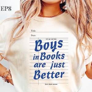 May include: Cream-colored t-shirt with the text "Boys in Books are just Better" in blue, designed to look like notebook paper. The shirt also has the text "Let's get stuff done" and "You're kinda awesome".
