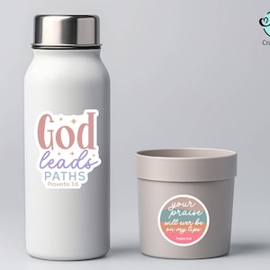 May include: A white water bottle and a gray container with stickers. The water bottle has a sticker with the text "God leads PATHS Proverbs 3:6". The container has a sticker with the text "your praise will ever be on my lips Psalm 8:6".