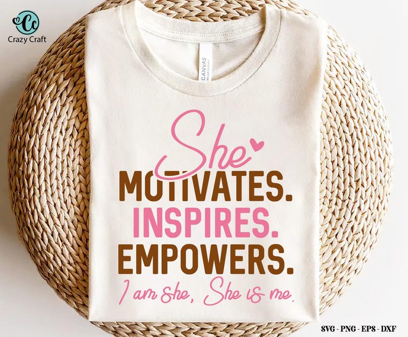 May include: A white t-shirt with the text "She motivates. Inspires. Empowers. I am She, She is me." in brown and pink lettering.