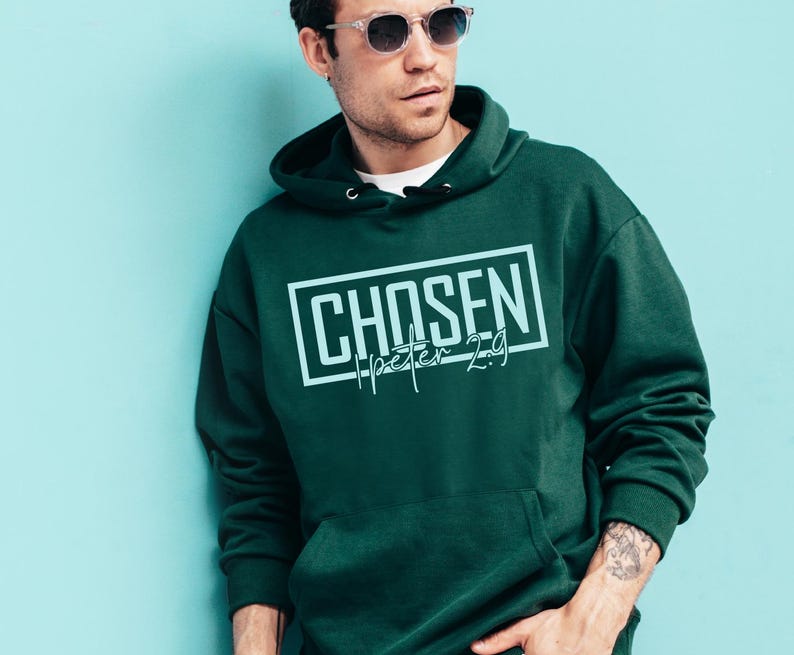 May include: A dark green hooded sweatshirt with the text "CHOSEN 1 Peter 2:9" in a light blue color.
