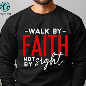 May include: Black sweatshirt with white text that reads "Walk by Faith not by sight". The word "Faith" is in red.