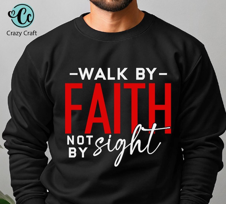 May include: Black sweatshirt with white text that reads "Walk by Faith not by sight". The word "Faith" is in red.