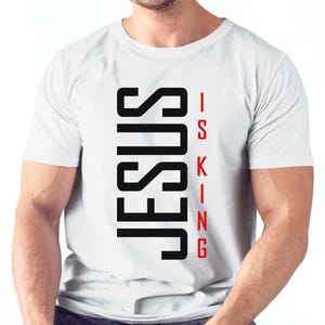 May include: White t-shirt with black text that reads "JESUS IS KING" in a vertical format.