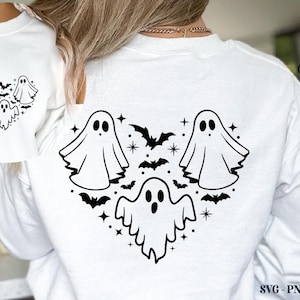 May include: White sweatshirt featuring a heart-shaped design of three cartoon ghosts and bats. The design is in black and includes stars. The Crazy Craft logo is visible in the upper right corner. The bottom right corner has the text "SVG - PNG - EPS - DXF".