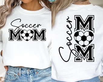 May include: White sweatshirt with the text "Soccer Mom" in black script and block letters, featuring a soccer ball heart design. The back of the sweatshirt also displays the text "Soccer Mom" with a soccer ball heart.