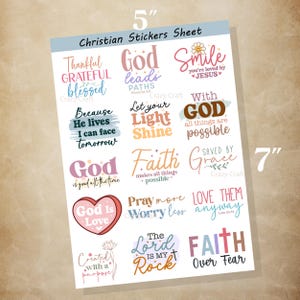 May include: A 5" x 7" sheet of Christian stickers with various inspirational quotes and phrases in different fonts and colors. The sheet includes phrases like "God is Love," "Faith Over Fear," and "Smile you're loved by Jesus."