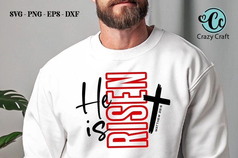May include: White sweatshirt with the text "He is Risen" in black and red, with a black cross. The text "Matthew 28:6" is below the cross. The Crazy Craft logo is in the upper right corner.