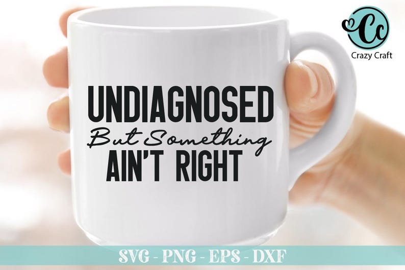 May include: White ceramic coffee mug with black text that reads "UNDIAGNOSED But Something AIN'T RIGHT".
