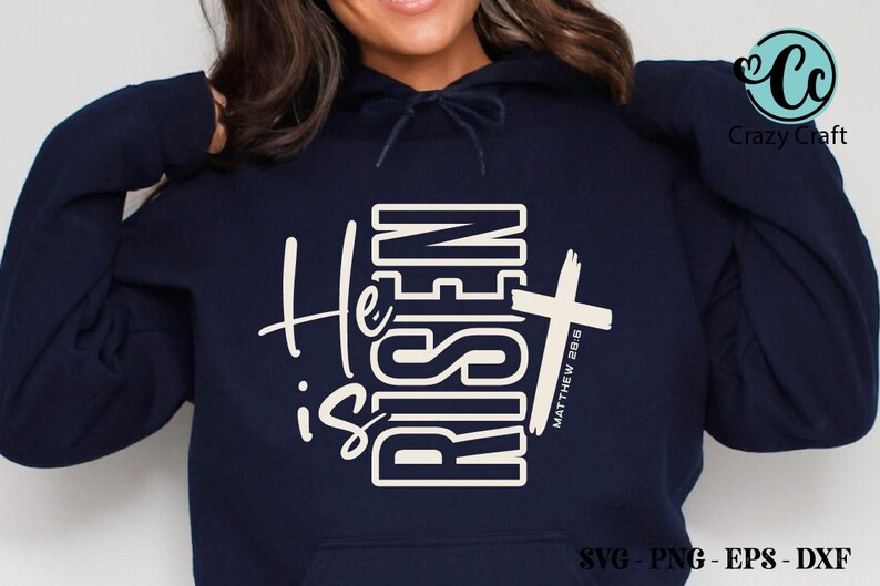 May include: Navy blue hoodie with the words "He is Risen" in white, along with a white cross and the text "Matthew 28:6." The hoodie also has the Crazy Craft logo and SVG, PNG, EPS, and DXF file type information.