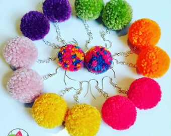 Colourful small pom pom earrings on sterling silver hooks