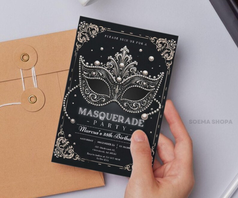 May include: A black rectangular invitation card featuring a silver masquerade mask graphic with pearl accents, ornate corner flourishes, and white text that reads: PLEASE JOIN US FOR A MASQUERADE PARTY, Marcus's 35th Birthday, SATURDAY, DECEMBER 25, AT 10:00PM.