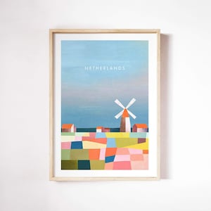 Könnte beinhalten: Ein gerahmter Druck einer farbenfrohen Illustration eines Windmühlen und Häuser in einem Feld. Der Text "NETHERLANDS" befindet sich oben auf dem Druck.