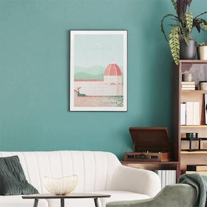 May include: A framed illustration of a building with a dome in Florence, Italy. The illustration is in a minimalist style with a muted color palette. The text "Florence" is printed at the top of the illustration.