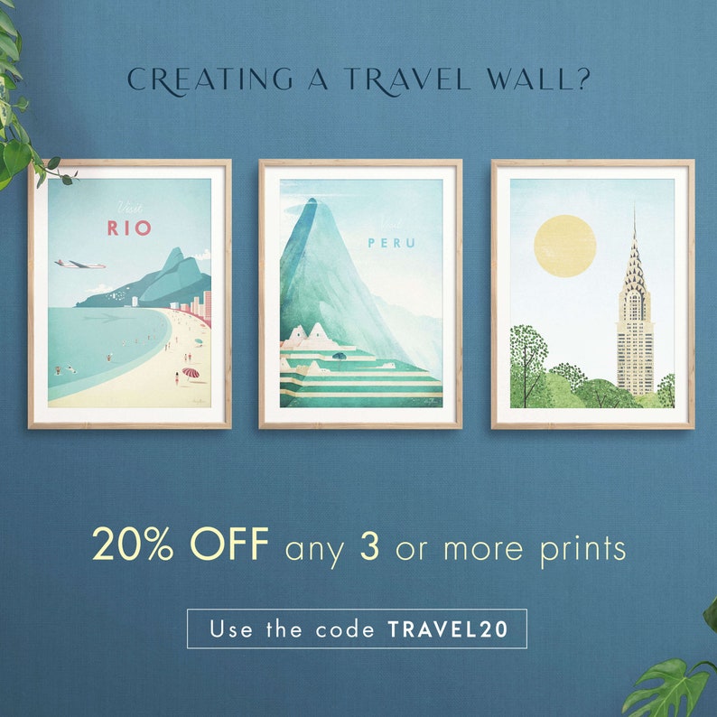 May include: Three framed travel posters with a 20% off sale for orders of 3 or more prints. The posters feature illustrations of Rio de Janeiro, Peru, and New York City. The text "CREATING A TRAVEL WALL?" is at the top of the image. The text "20% OFF any 3 or more prints" is in the center of the image. The text "Use the code TRAVEL20" is at the bottom of the image.