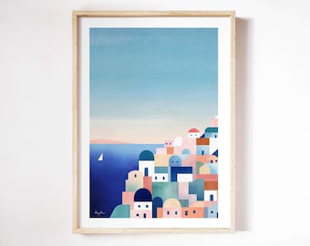 以下が含まれることがあります： 額装されたアートプリントで、海岸沿いの村の風景を描いています。 このアートワークは、丘を下って深い青い海に向かうカラフルな建物が特徴です。 小さなヨットが、薄い青色の空の下の水面に浮かんでいます。