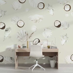 May include: A light green wall with a white desk and chair in front of it. The wall is decorated with a pattern of white seashells and coconuts.