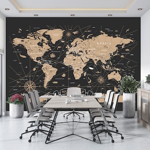 May include: A black and gold world map wallpaper mural with a compass rose and nautical details. The map is displayed in a modern office setting with a wooden table and chairs.