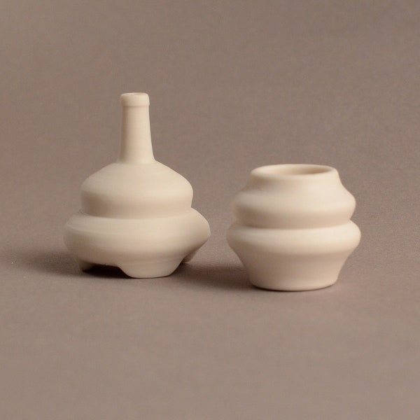 Porcelain set of handmade mini-vases without glazing. Two miniature tiny vases 1:6 scale. Miniature ceramics.