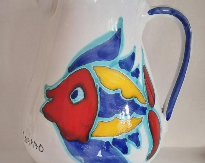 Featured listing image: 1970s Italian Corrao Hand-Painted Ceramic Pitcher, Featuring A  Multicoloured Fish Motif On A White Glaze Background.