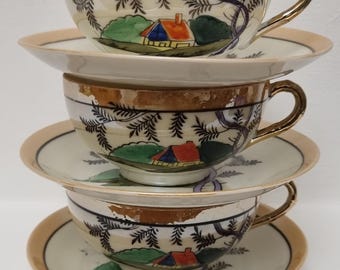 Mid Century Japanese Hand-Painted Cottage Scene Lustreware Porcelain Teacups & Saucers. Set of 3.