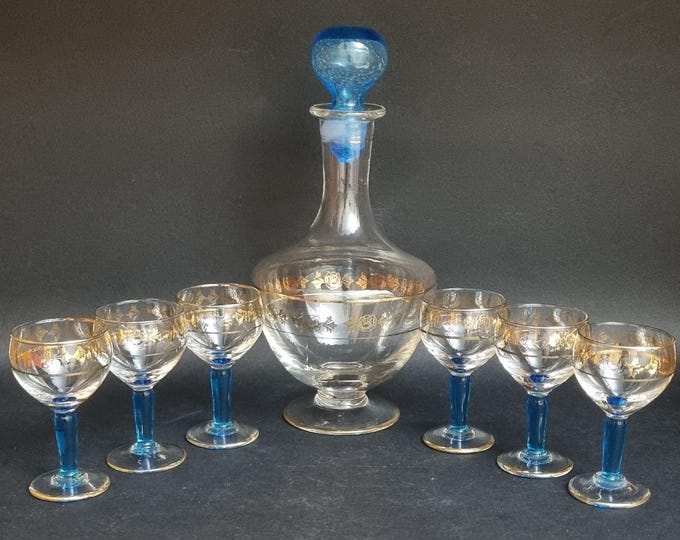 Featured listing image: Mid Century Czech Bohemian Gold & Teal Blue Decanter and Liqueur Wine Glasses - Set of 7.