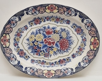 Large Mid Century Japanese Oval Porcelain Serving Platter Featuring an Oriental Multicoloured Floral Pattern.