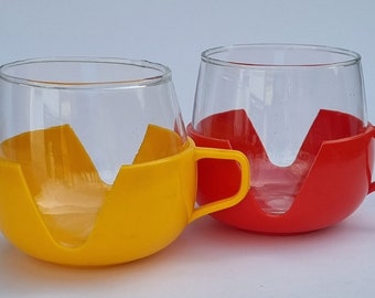 A Set of 2 Very Cool Vintage 1970s Dutch Tea Cup Consisting of Glass and Plastic Holder. Made in Holland.