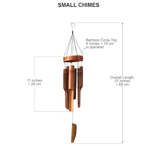 May include: A set of wooden wind chimes with a circular top and five hanging tubes. The chimes are 27 inches (68 cm) long and the top is 4 inches (10 cm) in diameter.