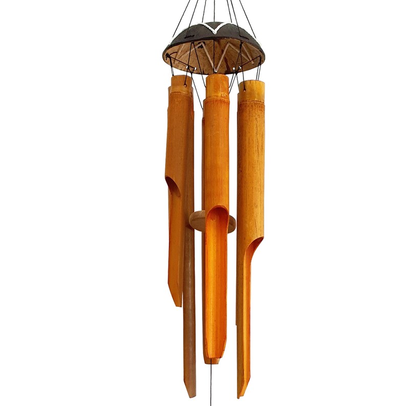 May include: A bamboo wind chime with five hollow tubes, each with a different length and tone. The tubes are suspended from a black and white wooden top with a string.