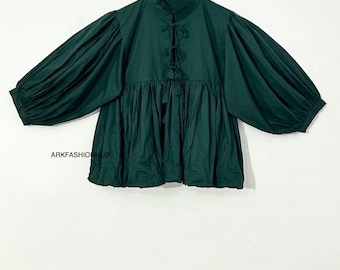 May include: A dark green blouse with long, voluminous sleeves and a high, ruffled collar. The blouse features a tie-up detail at the neckline and a gathered, flared hem. The text "ARKFASHIONHUB" is visible on the garment.