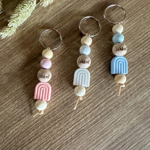 Keyring pendant wooden beads rainbow silicone pearl gift school child school enrollment pink blue white school cone back to school