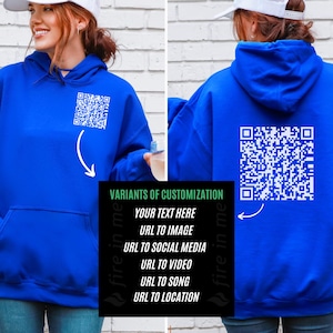 May include: A royal blue hoodie with a white QR code printed on the back. The hoodie has a drawstring hood and a kangaroo pocket. The text "fire in me" is printed on the side of the hoodie.