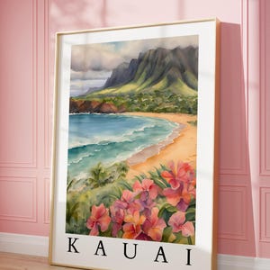 May include: A watercolor painting of a beach scene in Kauai, Hawaii. The painting features a lush green mountain range in the background, a sandy beach with turquoise water, and pink flowers in the foreground. The text "KAUAI" is printed at the bottom of the painting.