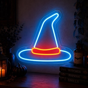 May include: A neon sign shaped like a pointed witch hat with a wide brim. The outline of the hat is illuminated in bright blue, while the band around the base of the hat is illuminated in a vibrant red color, mounted on a clear acrylic backing.