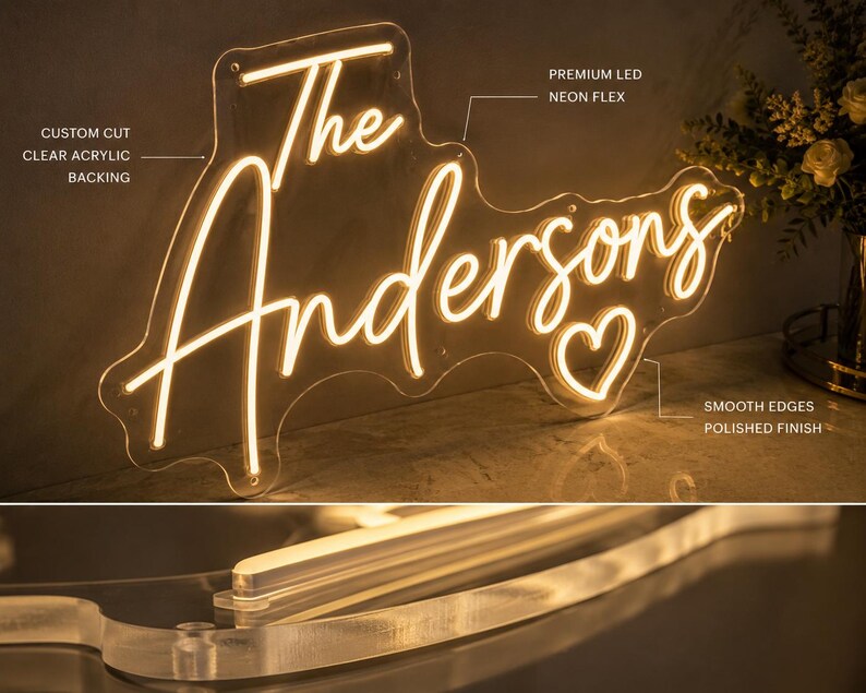 K&ouml;nnte beinhalten: Neon-Schild mit dem Schriftzug "The Andersons" in geschwungener Schrift, hergestellt aus hochwertigem LED-Neon-Flex und auf klarem Acryl montiert. Das Design beinhaltet ein Herzsymbol und hat glatte, polierte Kanten.