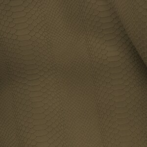 Peut inclure: Gros plan sur un tissu textur&eacute; avec un motif peau de serpent de couleur brun fonc&eacute;.