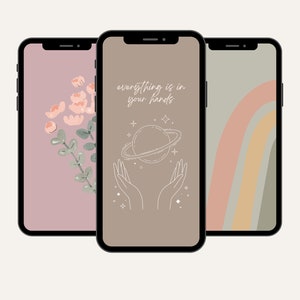 May include: Three phone screen mockups with different designs. The first has a pink background with a floral illustration. The second has a brown background with a hand holding a planet and the text "everything is in your hands". The third has a green background with a rainbow design.