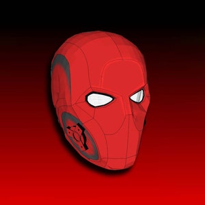 May include: A red and black mask with a geometric design. The mask has two eye holes and a small opening on the side.