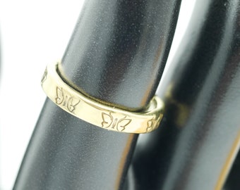 Ring finger ring with butterfly. Handmade from melted cartridge casings. Made in Cambodia. Fair Trade.