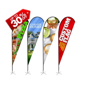 May include: Three different feather flags with various designs. The first flag is red with the text "CUSTOM FLAG" and "ANY LOGO COLOR DESIGN". The second flag is white with a coffee cup design and the text "JO'COFFEE NOW OPEN". The third flag is blue with a house design and the text "GARNIER HOMES".