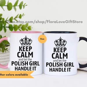 May include: Two 11-ounce white ceramic mugs with black rims. The mugs have a black crown and text that reads "Keep Calm and let the Polish Girl Handle It".
