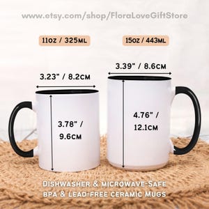 May include: Two white ceramic mugs with black handles and black rims. The mugs are 11oz and 15oz, and are dishwasher and microwave safe. The mugs are BPA and lead-free.