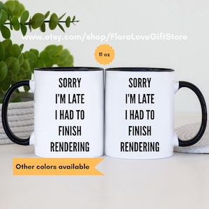May include: Two white ceramic mugs with black rims and handles. The mugs are 11 ounces and feature the text "Sorry I'm late I had to finish rendering".