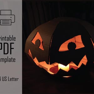 May include: A black paper jack-o'-lantern with cut-out eyes, nose, and mouth, illuminated from within by a warm, orange glow. The image includes the text "Printable PDF Template" and "A4 & US Letter".