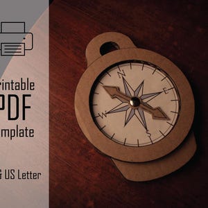 Puede incluir: Una brújula de papel detallada con un diseño de estrella en la esfera. La brújula es marrón con una esfera blanca y marcas negras. La imagen también incluye el texto "Printable PDF Template" y "A4 & US Letter".