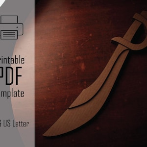 Puede incluir: Un recorte de cartón marrón de una espada curva, con empuñadura y hoja. La imagen también incluye el texto "Printable PDF Template" y "A4 & US Letter" junto a un icono de impresora.